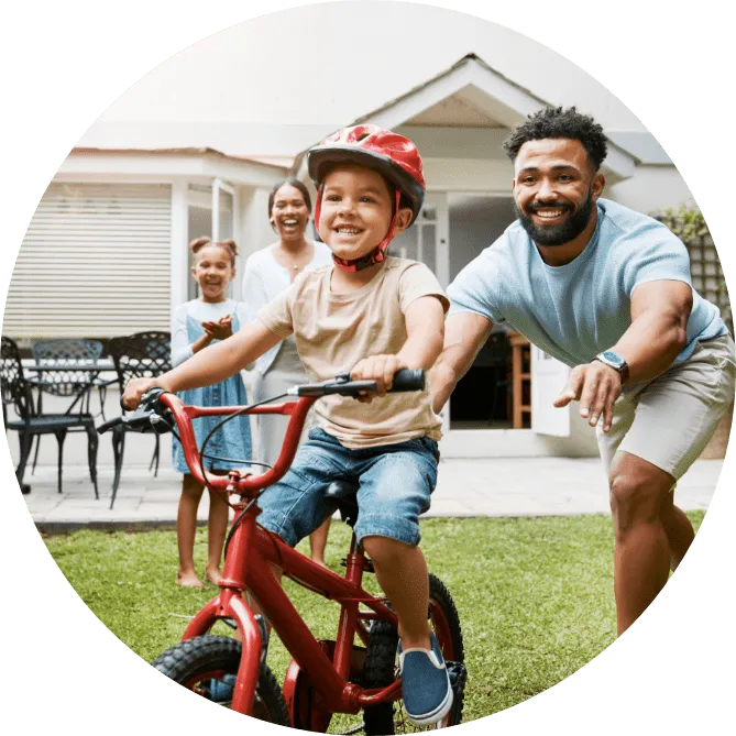 A family playing in the back yard.