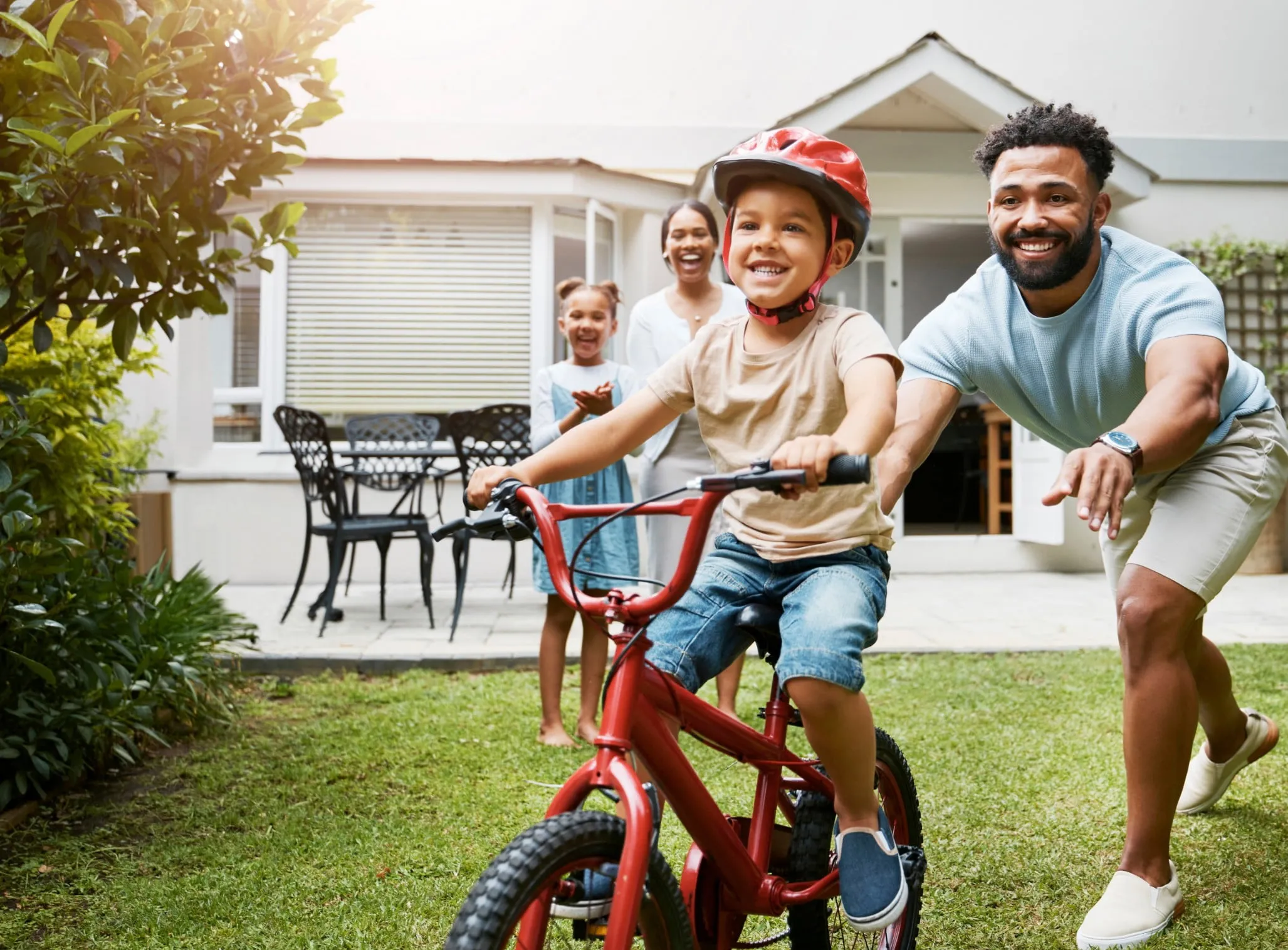 A family playing in the back yard.