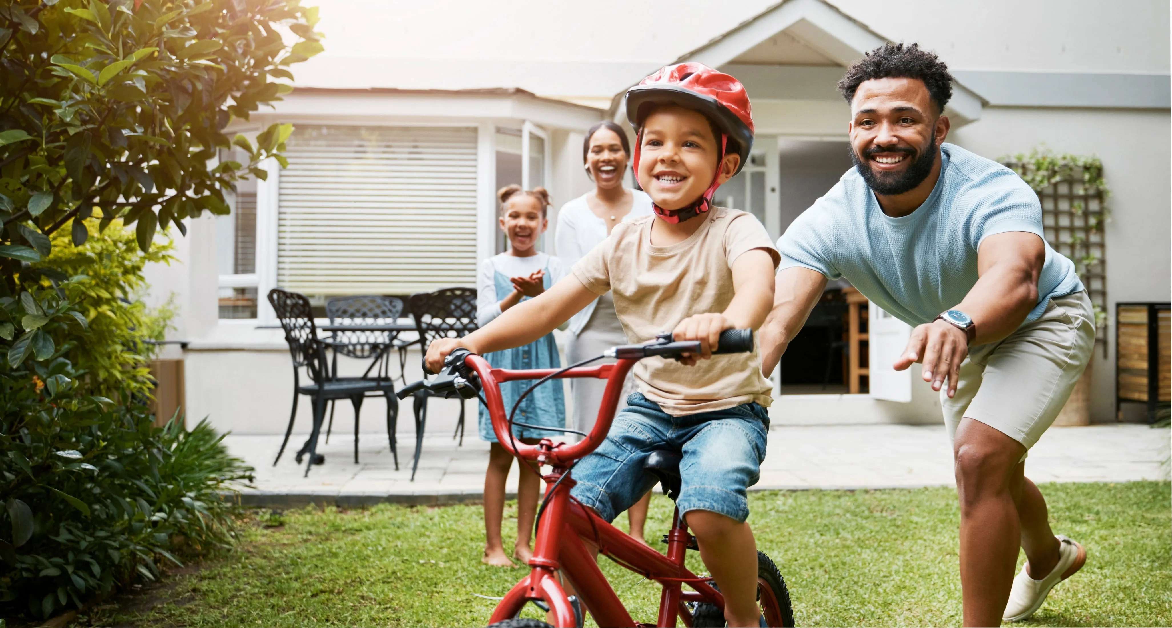 A family playing in the back yard.